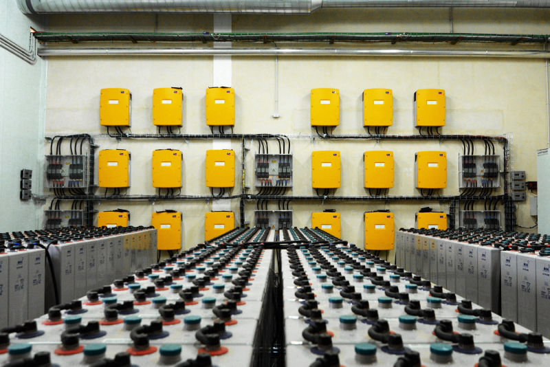Technical room with Sunny Island battery inverters and batteries